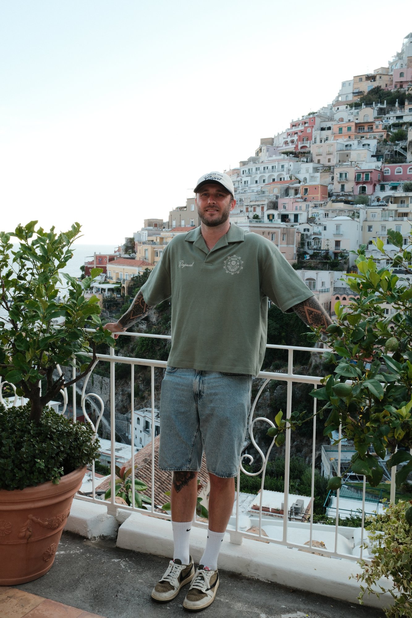 Dom Gunn-Taylor on a balcony in Positano, Italy